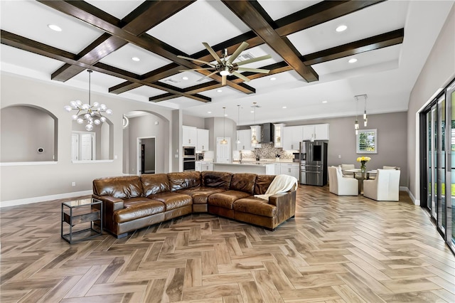 12607 Pensacola Ct, Riverview, FL 33579 - living area featuring arched walkways, a ceiling fan, beamed ceiling, coffered ceiling, and recessed lighting