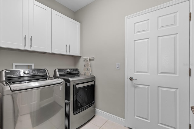 12607 Pensacola Ct, Riverview, FL 33579 - laundry area with washing machine and dryer, cabinet space, and light tile patterned floors
