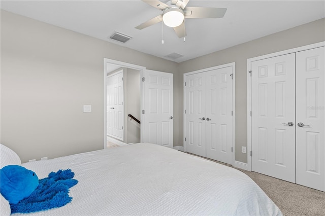 12607 Pensacola Ct, Riverview, FL 33579 - bedroom featuring multiple closets, carpet flooring, and ceiling fan