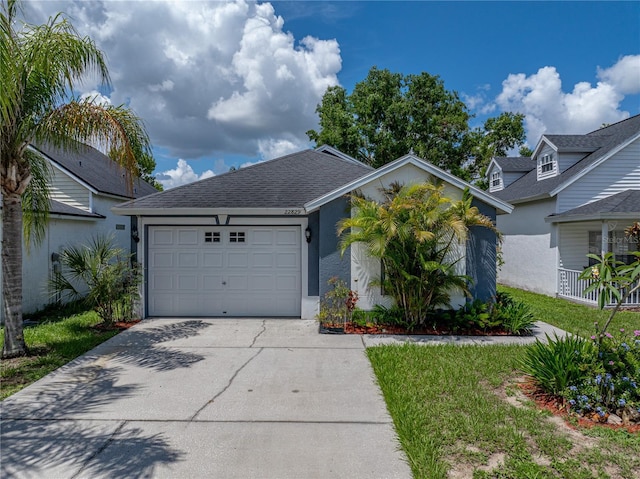 22829 Saint Thomas Cir, Lutz, FL 33549 - view of front of property featuring concrete driveway, a garage, stucco siding, and a shingled roof