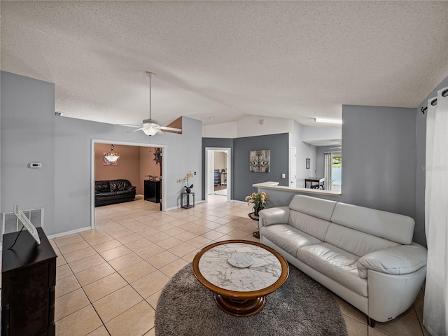 22829 Saint Thomas Cir, Lutz, FL 33549 - living area featuring lofted ceiling, light tile patterned flooring, ceiling fan, and a textured ceiling