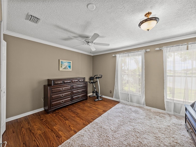 22829 Saint Thomas Cir, Lutz, FL 33549 - bedroom featuring crown molding, dark wood-style floors, a textured ceiling, and a ceiling fan