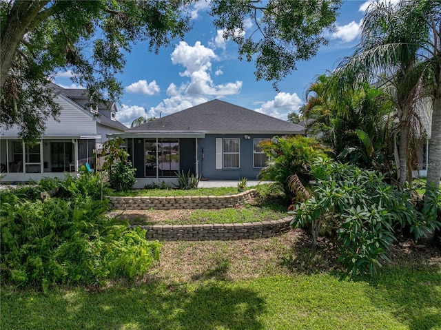 22829 Saint Thomas Cir, Lutz, FL 33549 - rear view of property with a sunroom, a lawn, and stucco siding