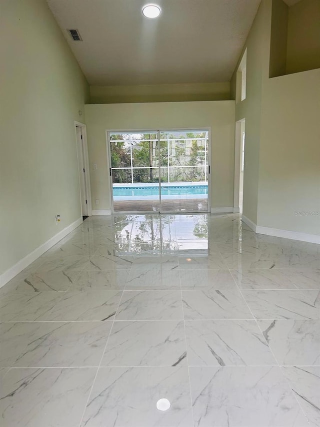 10444 Fordham St, Spring Hill, FL 34608 - unfurnished room featuring marble finish floors and recessed lighting