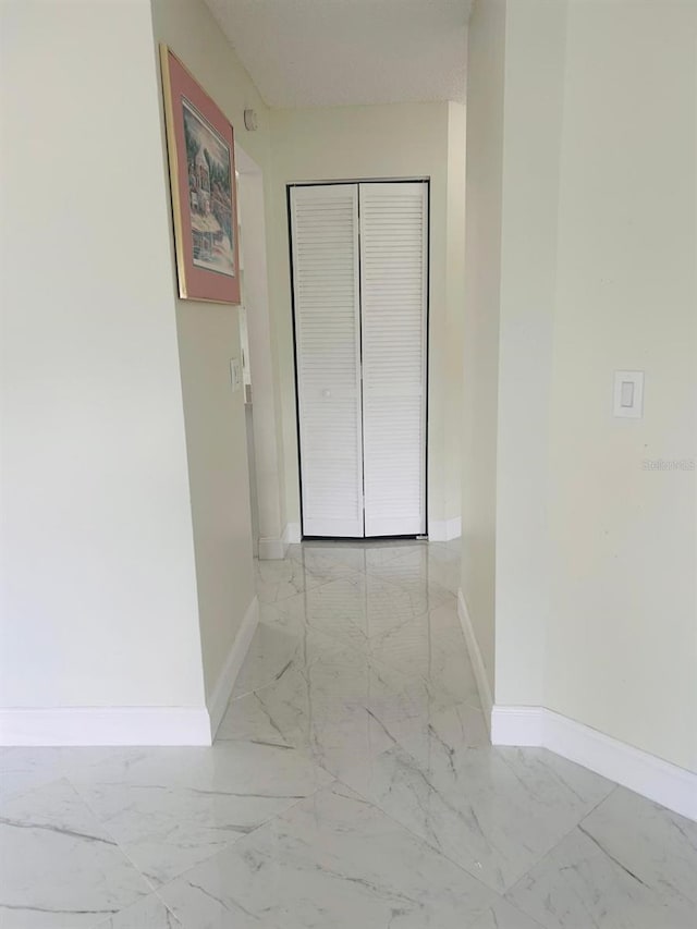 10444 Fordham St, Spring Hill, FL 34608 - corridor with light marble finish flooring and baseboards