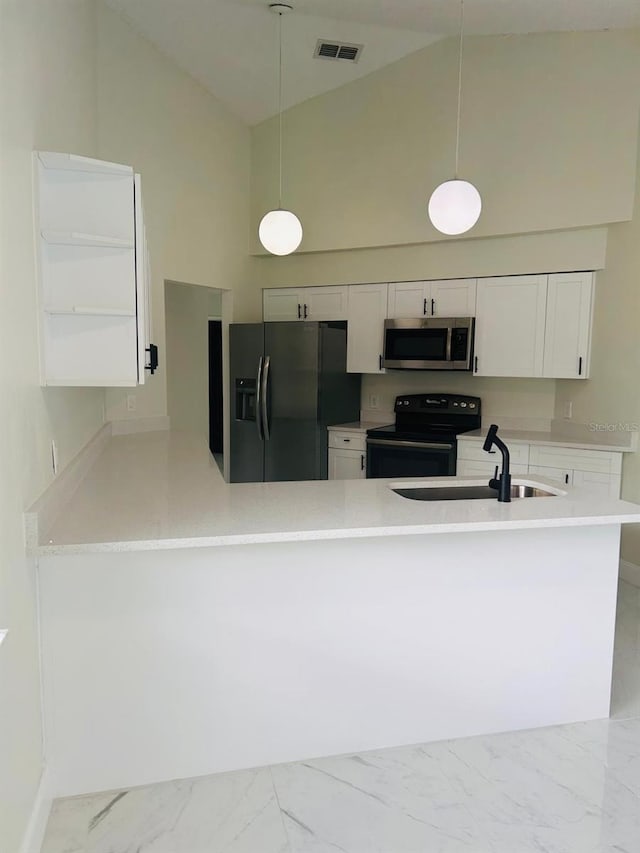 10444 Fordham St, Spring Hill, FL 34608 - kitchen featuring stainless steel microwave, black range with electric cooktop, refrigerator with ice dispenser, high vaulted ceiling, and marble look tile flooring