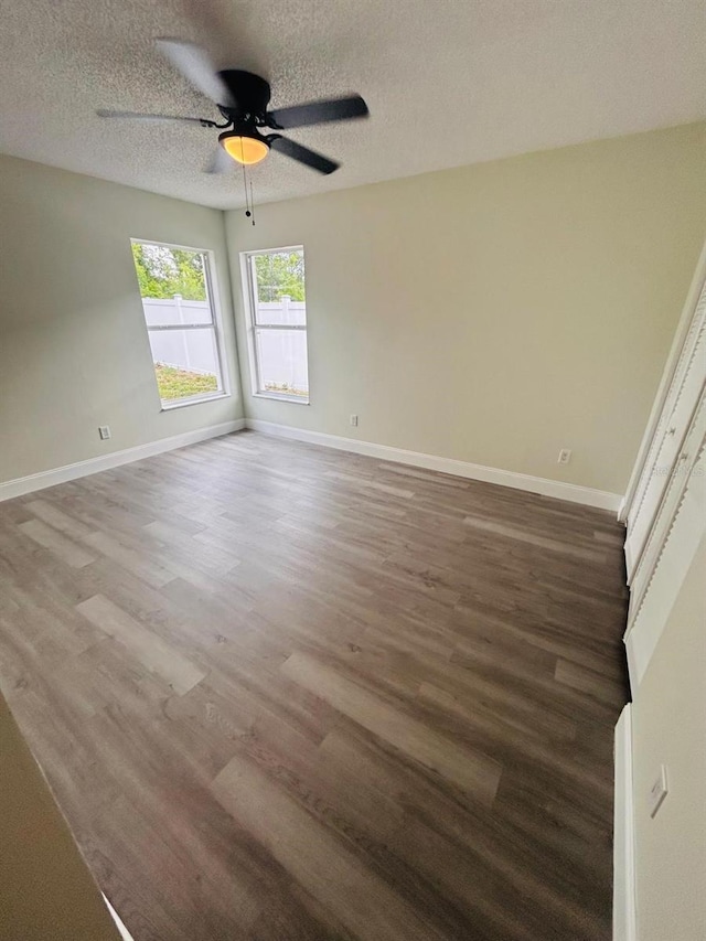 10444 Fordham St, Spring Hill, FL 34608 - empty room with wood finished floors, ceiling fan, and a textured ceiling