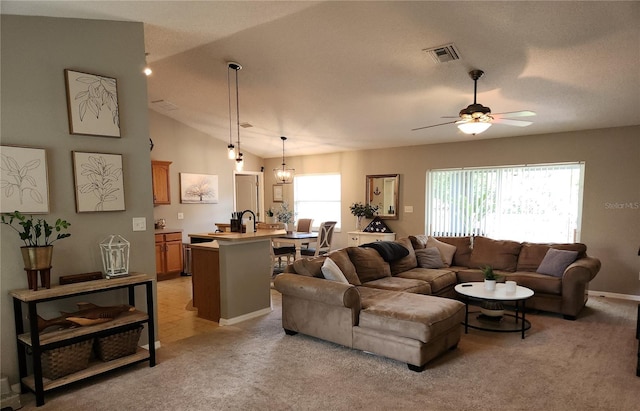 2509 Montecito Ave, Eustis, FL 32726 - living area with ceiling fan, vaulted ceiling, and light carpet