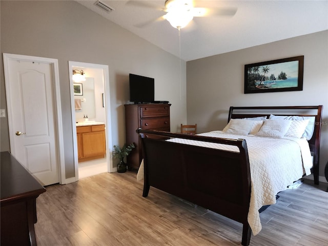 2509 Montecito Ave, Eustis, FL 32726 - bedroom featuring light wood-style floors, a ceiling fan, ensuite bath, and high vaulted ceiling