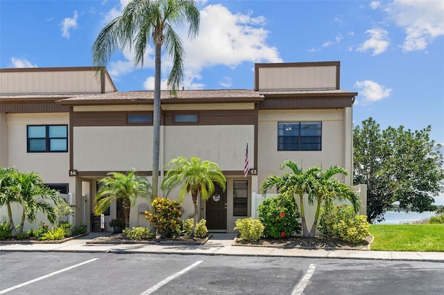 9209 Seminole Blvd Unit 13, Seminole, FL 33772 - view of front of home with uncovered parking and stucco siding