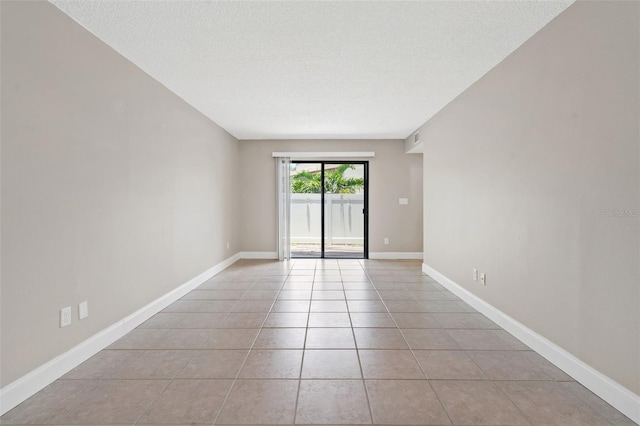 9209 Seminole Blvd Unit 13, Seminole, FL 33772 - unfurnished room featuring light tile patterned floors and a textured ceiling