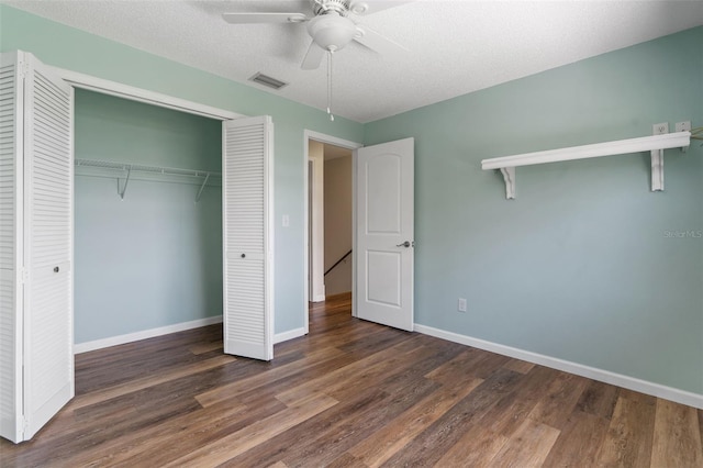 9209 Seminole Blvd Unit 13, Seminole, FL 33772 - unfurnished bedroom featuring a closet, wood finished floors, ceiling fan, and a textured ceiling