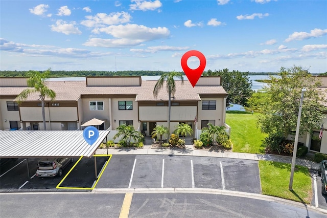 9209 Seminole Blvd Unit 13, Seminole, FL 33772 - view of building exterior with uncovered parking