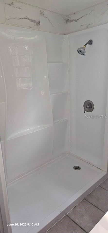1908 S Kingsway Rd, Seffner, FL 33584 - bathroom with a shower stall and tile patterned floors