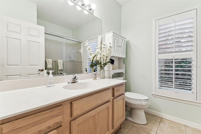17906 Loretta Ln, Lutz, FL 33548 - bathroom featuring tile patterned floors, a shower with door, and vanity