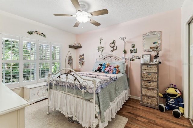 17906 Loretta Ln, Lutz, FL 33548 - bedroom featuring wood finished floors, ceiling fan, and a textured ceiling