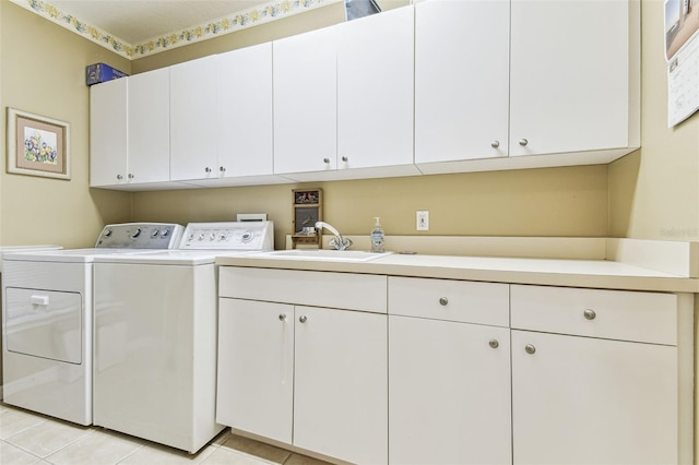 17906 Loretta Ln, Lutz, FL 33548 - laundry room with cabinet space, separate washer and dryer, and light tile patterned flooring