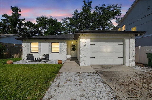 206 N Beverly Ave Unit 1/2, Tampa, FL 33609 - view of front of home featuring a garage, driveway, and stucco siding