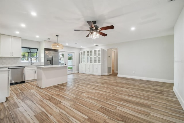 206 N Beverly Ave Unit 1/2, Tampa, FL 33609 - kitchen with stainless steel appliances, open floor plan, recessed lighting, white cabinetry, and ceiling fan