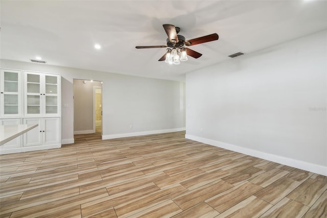 206 N Beverly Ave Unit 1/2, Tampa, FL 33609 - empty room with ceiling fan, light wood-type flooring, and recessed lighting