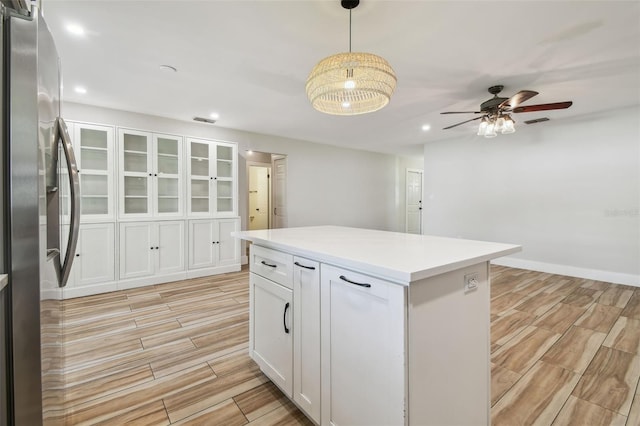 206 N Beverly Ave Unit 1/2, Tampa, FL 33609 - kitchen featuring stainless steel refrigerator with ice dispenser, wood tiled floors, white cabinets, recessed lighting, and ceiling fan