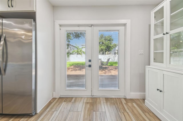 206 N Beverly Ave Unit 1/2, Tampa, FL 33609 - doorway with french doors and light wood finished floors