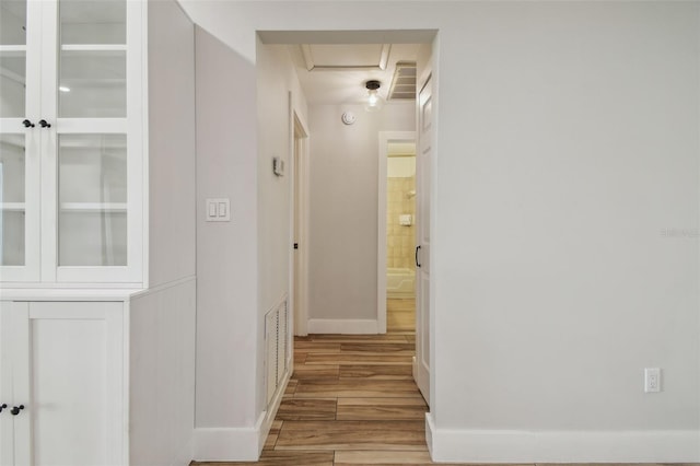206 N Beverly Ave Unit 1/2, Tampa, FL 33609 - hall featuring wood finished floors and attic access