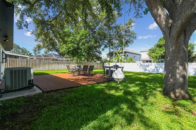 206 N Beverly Ave Unit 1/2, Tampa, FL 33609 - fenced backyard featuring a deck and outdoor dining space