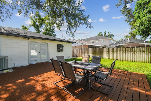 206 N Beverly Ave Unit 1/2, Tampa, FL 33609 - deck with french doors, outdoor dining space, and a fenced backyard