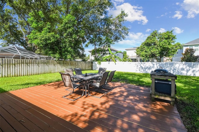 206 N Beverly Ave Unit 1/2, Tampa, FL 33609 - wooden terrace with outdoor dining area and a fenced backyard