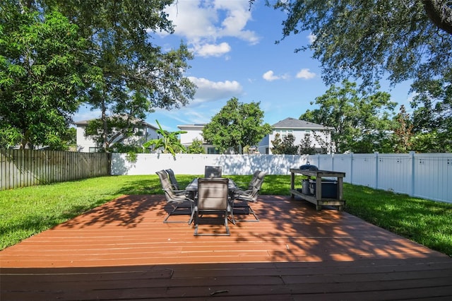 206 N Beverly Ave Unit 1/2, Tampa, FL 33609 - wooden deck with outdoor dining space and a fenced backyard