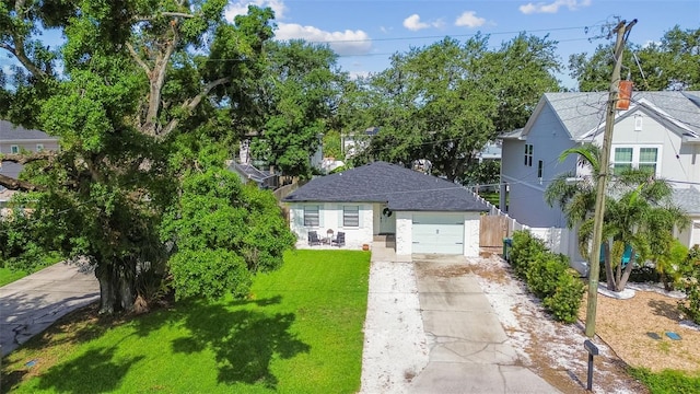 206 N Beverly Ave Unit 1/2, Tampa, FL 33609 - view of front facade with concrete driveway and an attached garage
