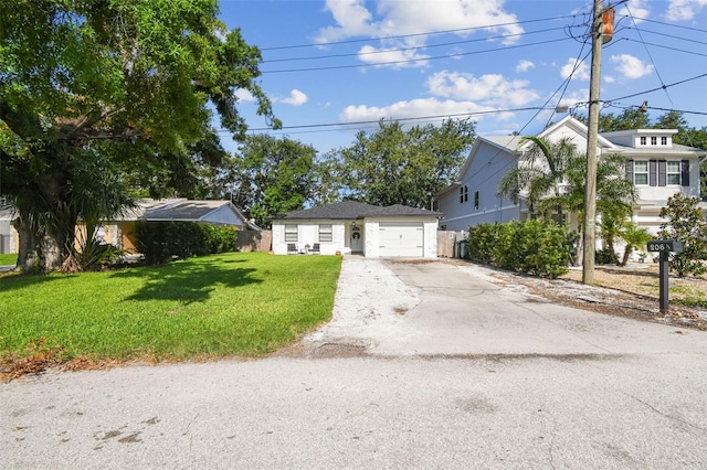 206 N Beverly Ave Unit 1/2, Tampa, FL 33609 - view of front facade featuring asphalt driveway, a front lawn, and an attached garage