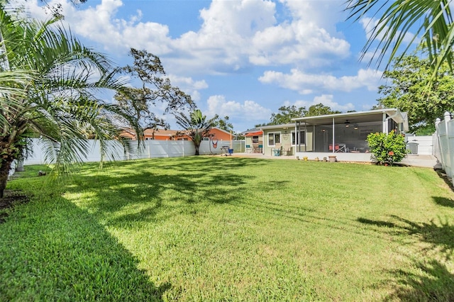 2025 Jefferson Ave, Dunedin, FL 34698 - fenced backyard featuring a sunroom