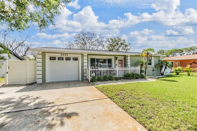 2025 Jefferson Ave, Dunedin, FL 34698 - ranch-style home featuring stucco siding, driveway, and a garage