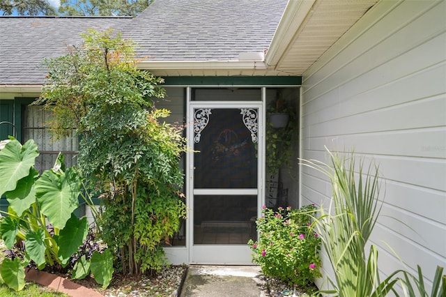 5301 Bayonne Ave, Spring Hill, FL 34608 - doorway to property with a shingled roof