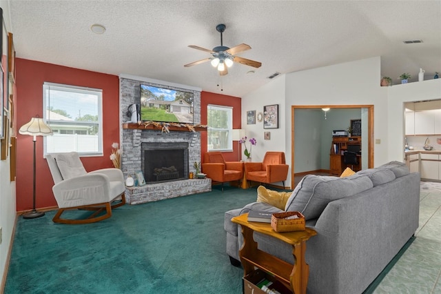 5301 Bayonne Ave, Spring Hill, FL 34608 - living room featuring ceiling fan, lofted ceiling, a brick fireplace, and a textured ceiling