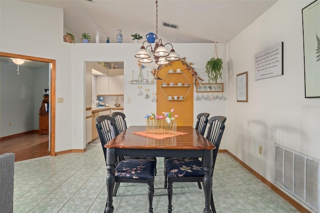 5301 Bayonne Ave, Spring Hill, FL 34608 - dining area with a chandelier and lofted ceiling