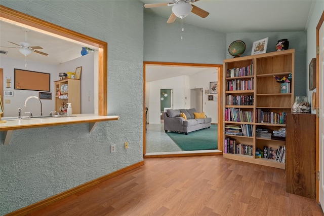 5301 Bayonne Ave, Spring Hill, FL 34608 - sitting room featuring ceiling fan, wood finished floors, and vaulted ceiling