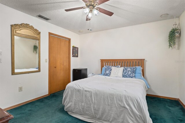 5301 Bayonne Ave, Spring Hill, FL 34608 - carpeted bedroom featuring a textured ceiling, a ceiling fan, and a closet
