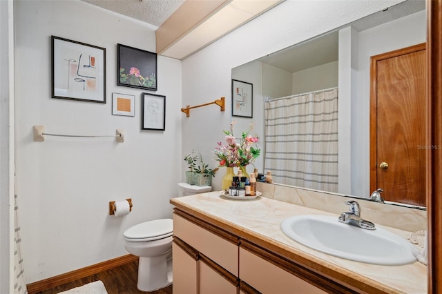 5301 Bayonne Ave, Spring Hill, FL 34608 - full bathroom featuring vanity, wood finished floors, and a textured ceiling