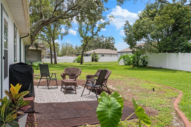 5301 Bayonne Ave, Spring Hill, FL 34608 - fenced backyard with a grill and a patio