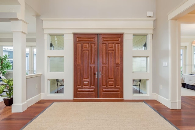442 Midway Is, Clearwater Beach, FL 33767 - foyer with wood finished floors and crown molding