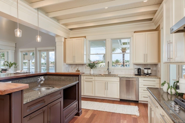 442 Midway Is, Clearwater Beach, FL 33767 - kitchen featuring appliances with stainless steel finishes, backsplash, beam ceiling, ventilation hood, and plenty of natural light