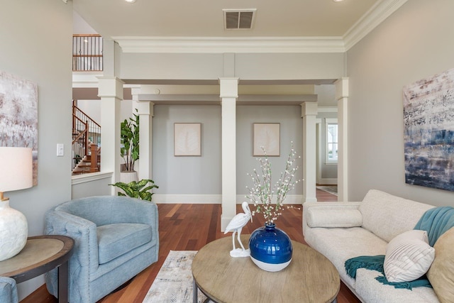 442 Midway Is, Clearwater Beach, FL 33767 - living room with wood finished floors, crown molding, decorative columns, and stairs