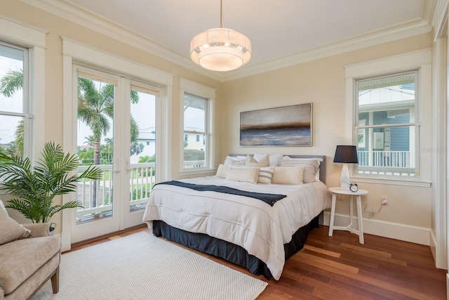442 Midway Is, Clearwater Beach, FL 33767 - bedroom with access to exterior, crown molding, and wood finished floors