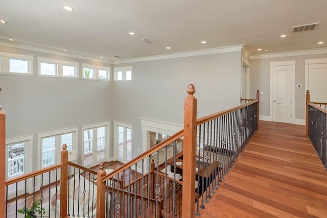 442 Midway Is, Clearwater Beach, FL 33767 - corridor with an upstairs landing, wood finished floors, crown molding, and recessed lighting