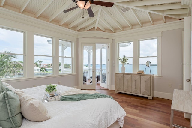 442 Midway Is, Clearwater Beach, FL 33767 - bedroom featuring access to exterior, a water view, light wood finished floors, and multiple windows