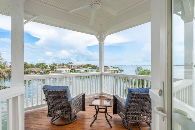 442 Midway Is, Clearwater Beach, FL 33767 - balcony featuring a ceiling fan and a deck with water view