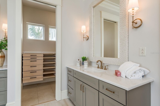 442 Midway Is, Clearwater Beach, FL 33767 - bathroom with vanity, tile patterned flooring, crown molding, and a spacious closet